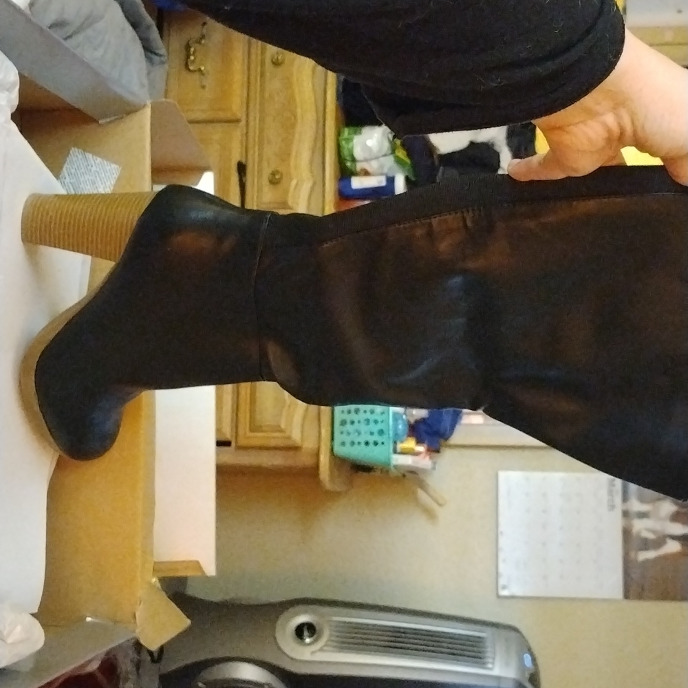 Knee high black zippered boots